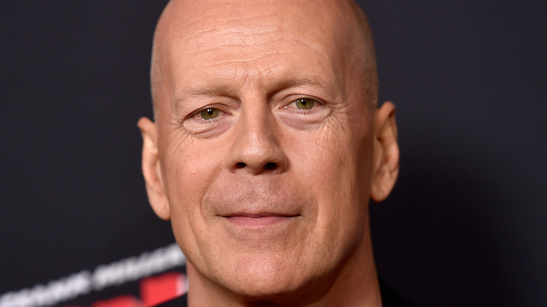 Bruce Willis posing on the red carpet