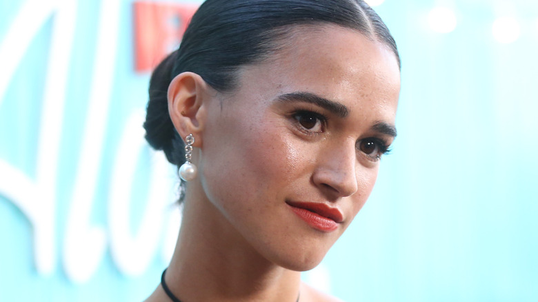 Emma Pasarow on red carpet in earrings