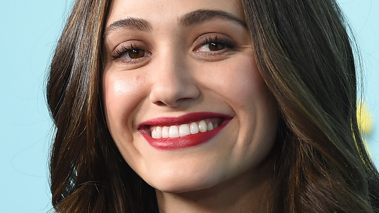 Emmy Rossum smiling at event