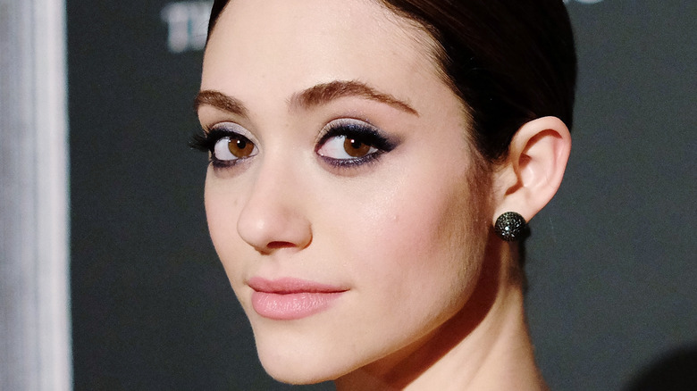 Emmy Rossum poses on the red carpet