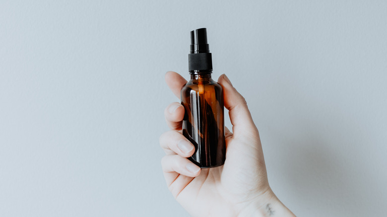 An amber spray bottle