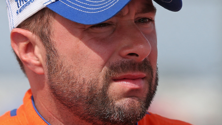 Eric McClure in baseball hat and beard