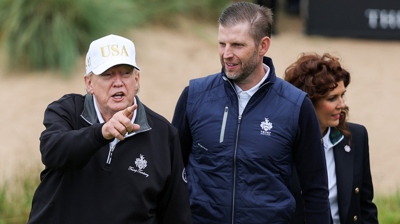 Eric Trump accompanying Donald Trump on the golf course