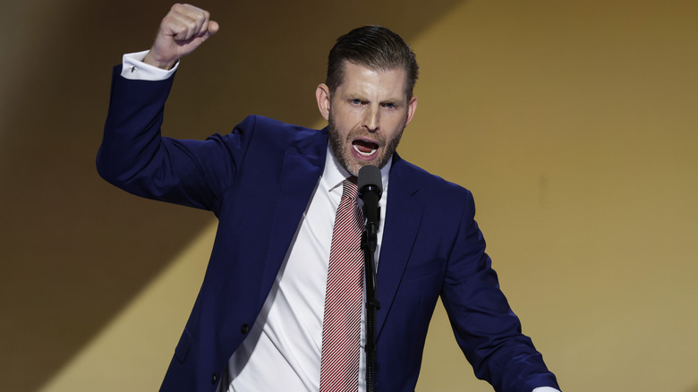 Eric Trump fist-pumping the air during a speech