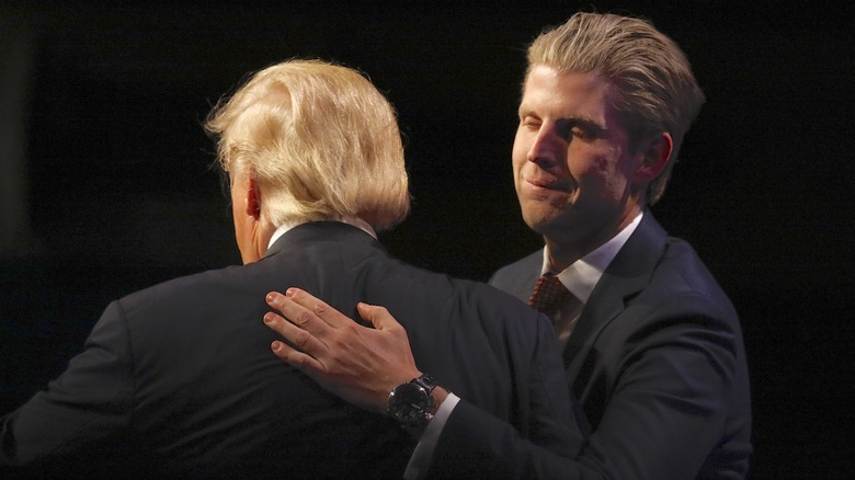 Eric Trump tries to hug his father