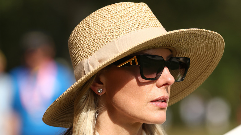 Erica Stoll wearing a hat and sunglasses