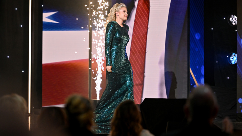 Erika Kirk wearing a sparkling green dress