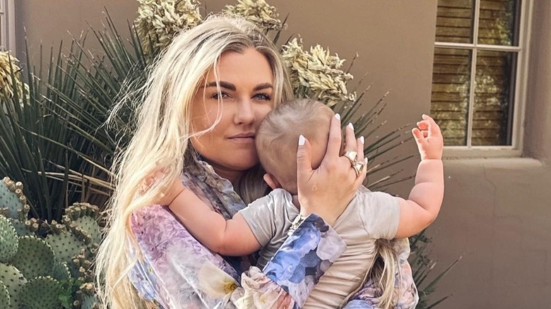 Erika Kirk holding baby daughter