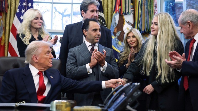 Donald Trump shakes hands with Erika Kirk in the Oval Office of the White House in Washington, DC (2025)