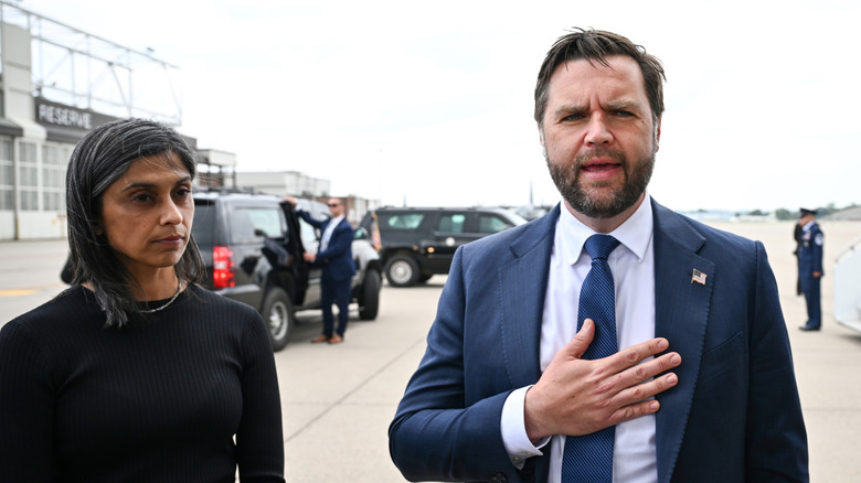 Usha Vance looking sad next to JD Vance