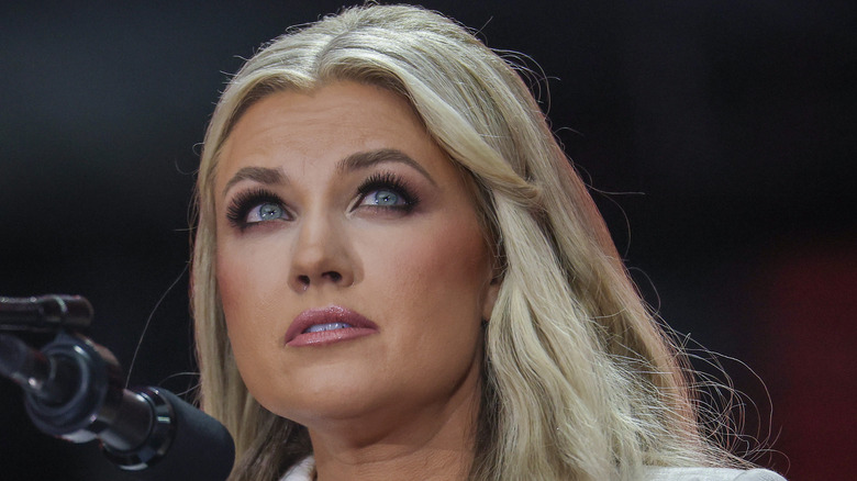 Erika Kirk looking up while onstage at her husband Charlie Kirk's memorial