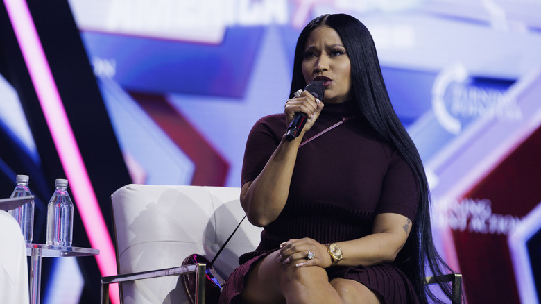 Nicki Minaj speaking on stage at AmericaFest
