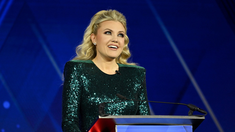Erika Kirk onstage in a sparkly green dress at the 2025 Patriot Awards