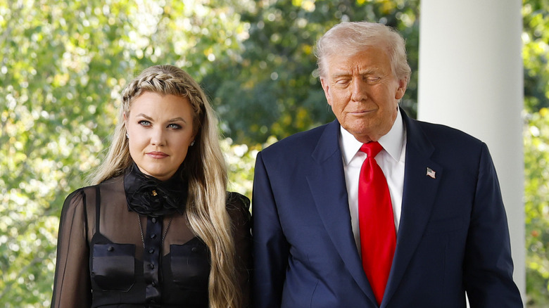 Erika Kirk and Donald Trump walking together outside