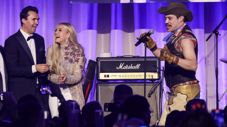 Charlie Kirk and Erika Kirk on stage at a performance