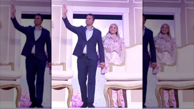 Erika Kirk and Charlie Kirk onstage at a Turning Point USA event