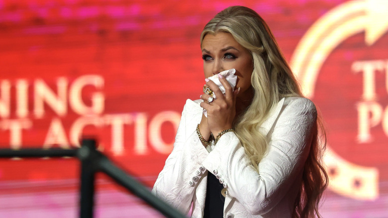 Erika Kirk holding tissues onstage at Charlie Kirk's memorial