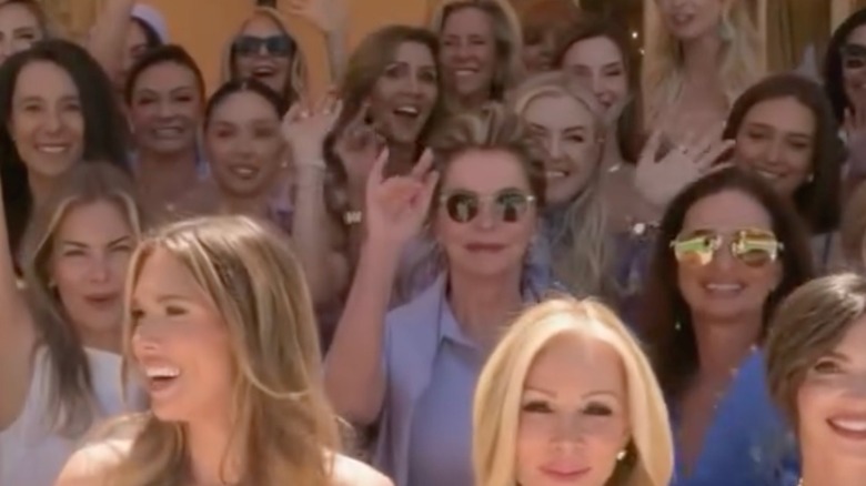 Erika Kirk's face being half covered in a group photo from Bettina Anderson's bridal shower