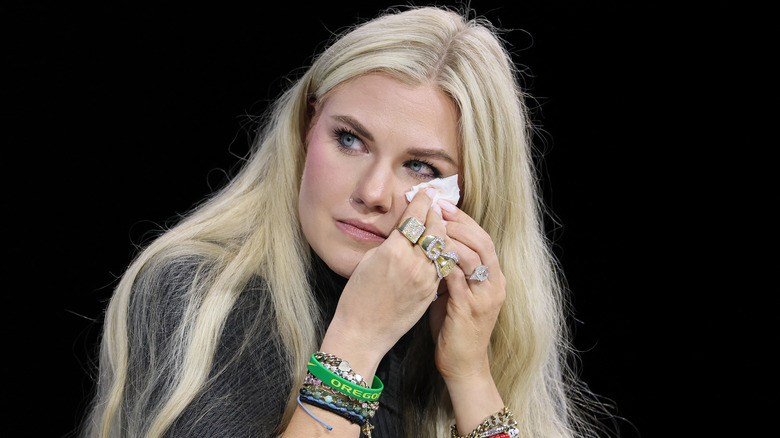 Erika Kirk dabbing her eyes with a tissue