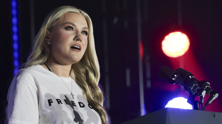 Erika Kirk in a white t-shirt with black lettering