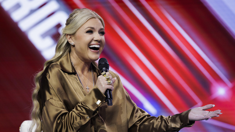 Erika Kirk smiling on stage