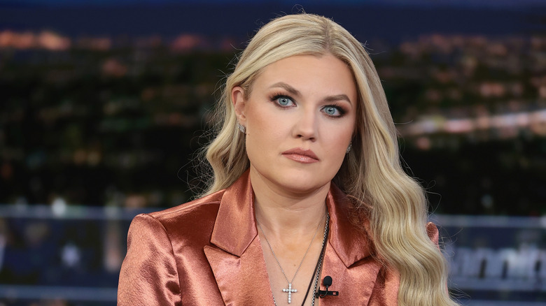 Erika Kirk making an appearance on Fox News in a shiny salmon blazer