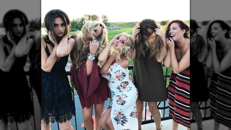 Erika Kirk doing silly poses with friends in 2017