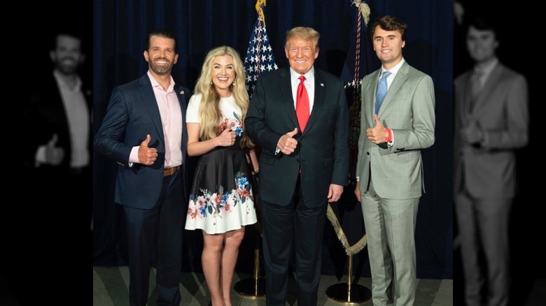 Erika and Charlie Kirk with Donald Trump and Donald Trump Jr. in 2020 giving thumbs up