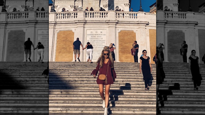Erika Kirk walking down steps in Rome in 2019