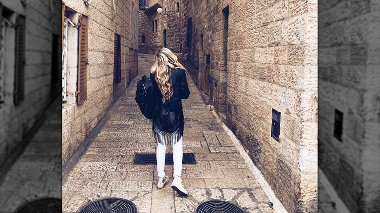 Erika Kirk looking up at stone building in Jerusalem in 2018