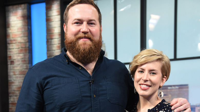 Erin and  Ben Napier smile on set 