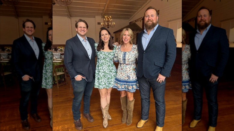 Erin and Ben Napier posing with friends at dinner