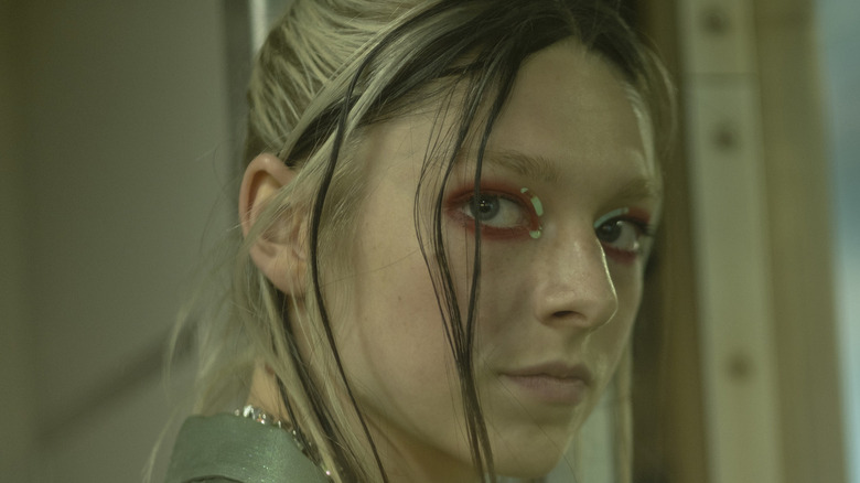 Hunter Schaefer still from Euphoria with lime and red eyeshadow