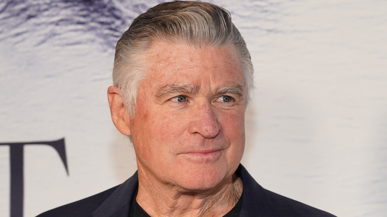 Treat Williams smirking