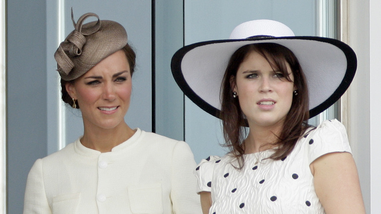 Catherine, Duchess of Cambridge and Princess Eugenie of York watch the racing from the balcony of the Royal Box as they attend Derby Day at the Investec Derby Festival at Epsom racecourse (2011)