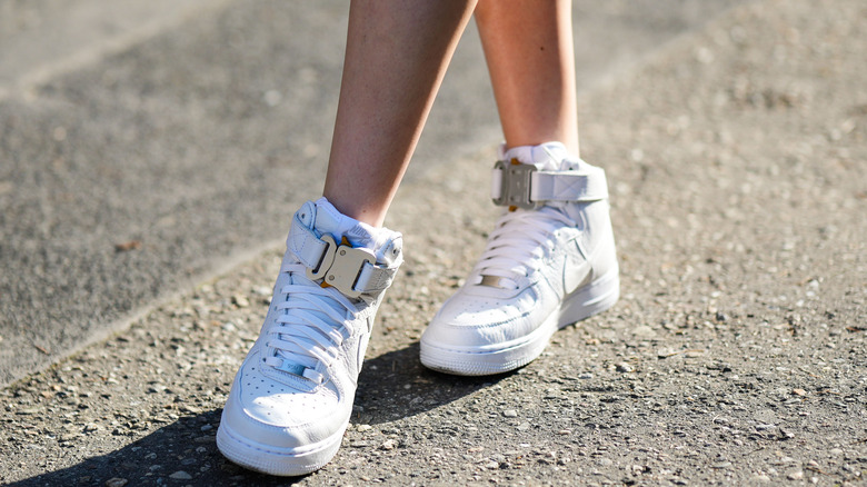 walking in Nike sneakers on pavement
