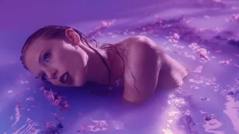 Taylor Swift in purple pool in Lavender Haze video
