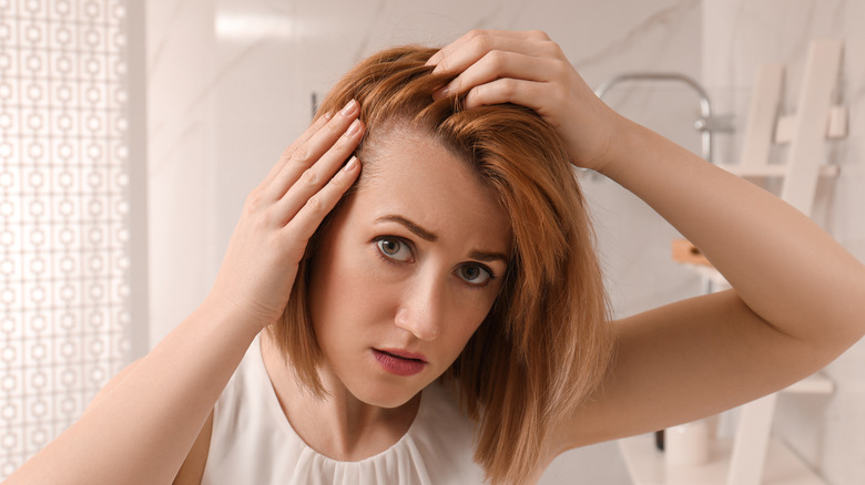 A woman experiencing hair loss