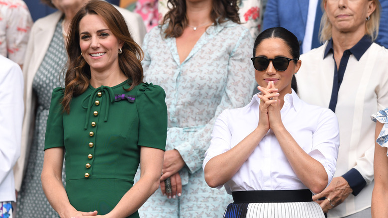 Kate Middleton and Meghan Markle watching an event