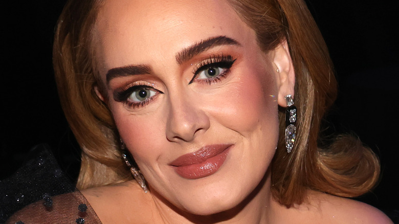 Adele poses at an event