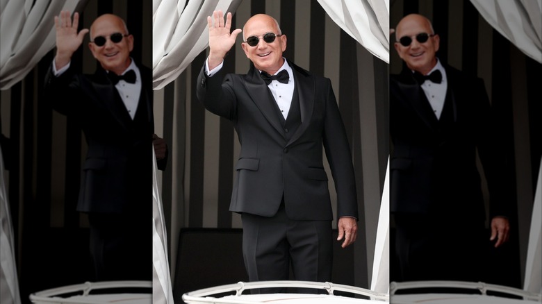 Jeff Bezos waving while wearing a tuxedo in Venice for his wedding