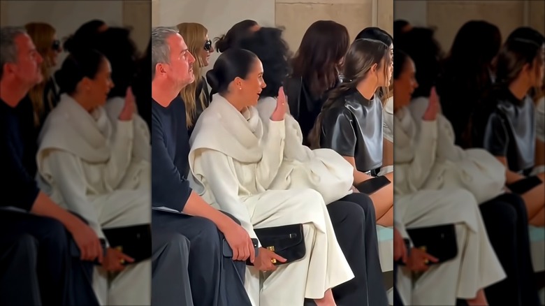 Meghan Markle laughing with others