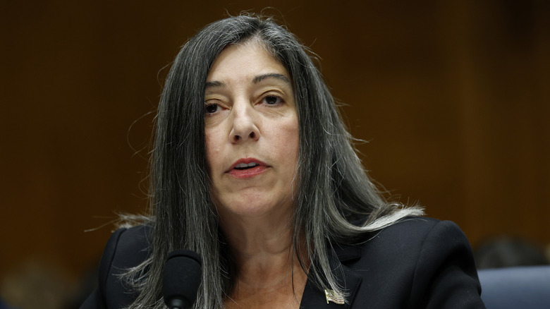 Debra Houry with straight gray hair wearing a black blazer