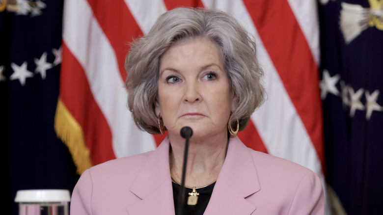 Susie Wiles with short gray hair wearing a pink blazer