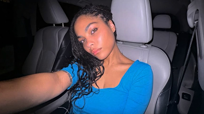 Bella Zahra Murphy in blue taking a selfie in her car