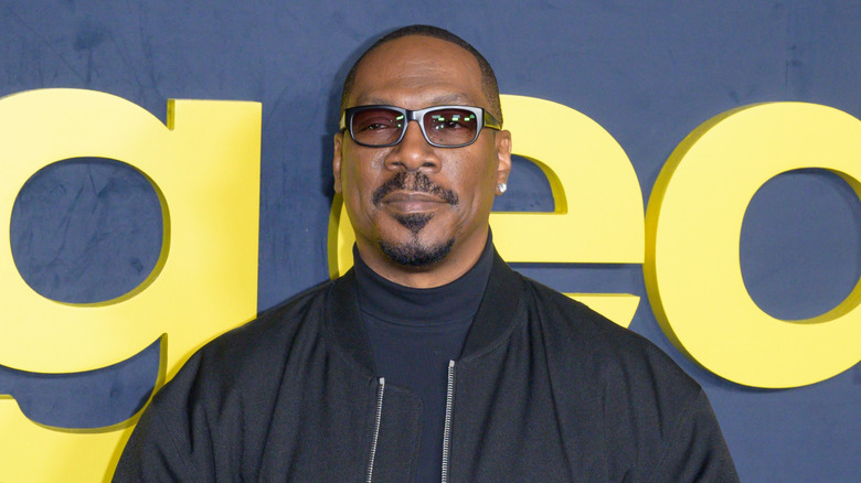 Eddie Murphy wearing black and tinted eyeglasses in 2025