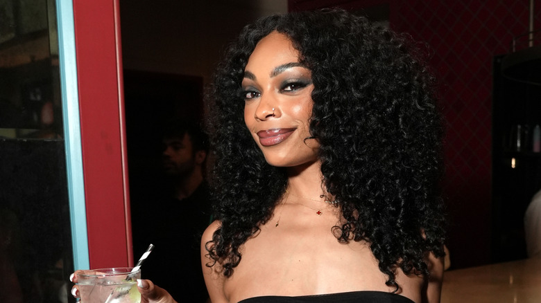 Shayne Audra Murphy holding a drink at a premiere