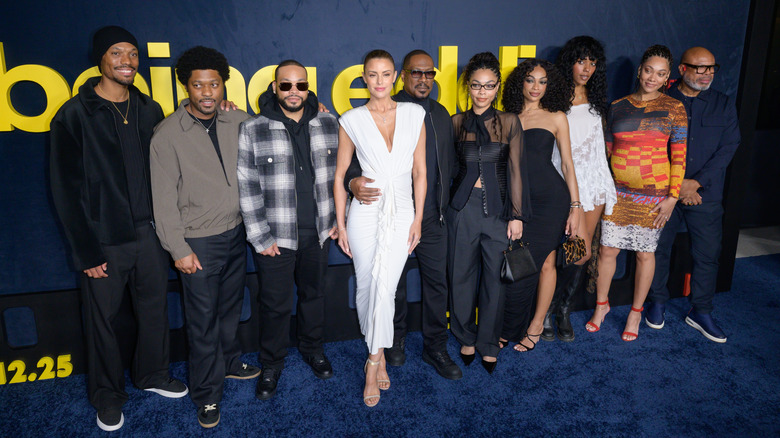 Eddie Murphy posing with seven of his kids and Paige Butcher
