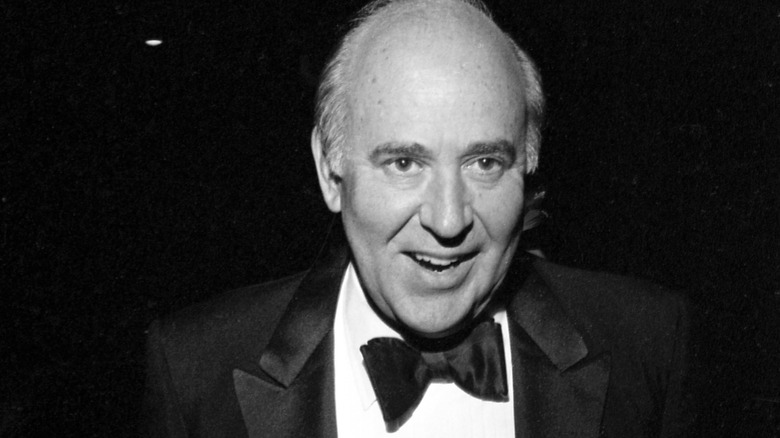 Carl Reiner wearing a suit around 1980