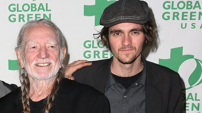 Willie Nelson and Jacob "Micah" Nelson wearing black